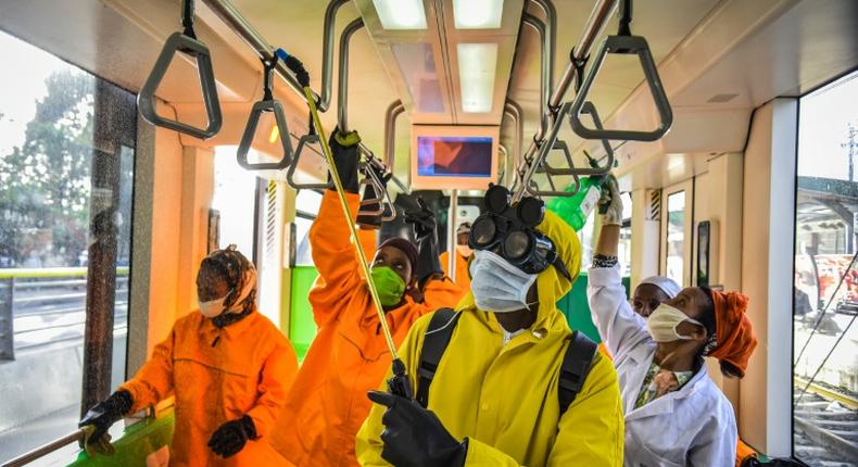 Cleaning staff disinfect a metro carriage in Addis Ababa -- Ethiopia announced its first COVID-19 deaths Sunday