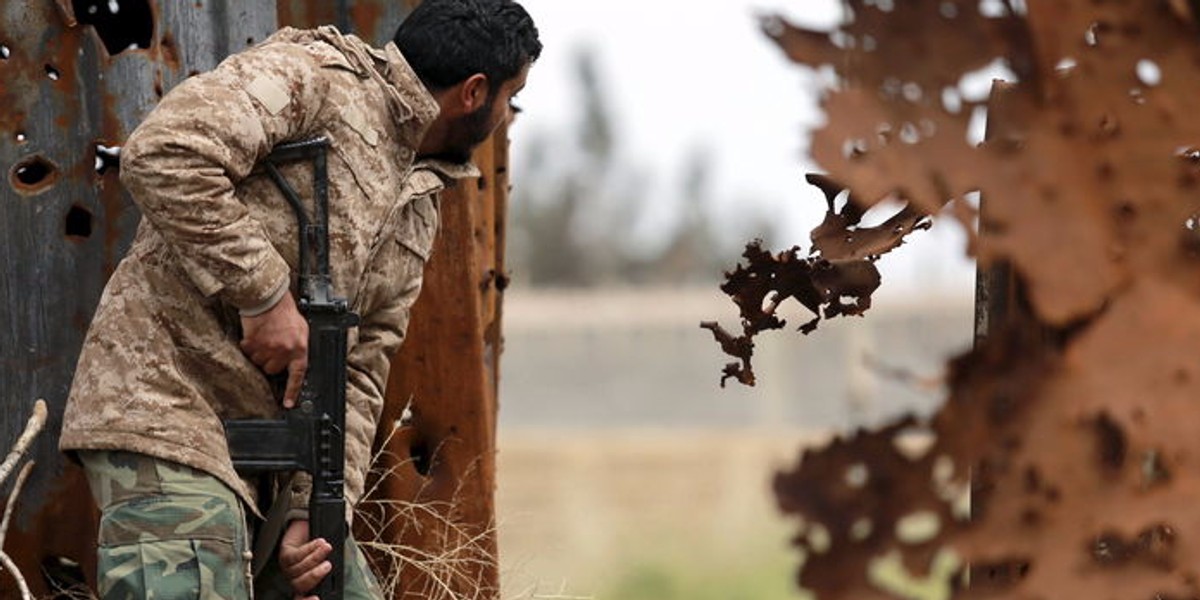 A member of the Libyan pro-government forces with a weapon during street clashes with the Shura Council of Libyan Revolutionaries in Benghazi.