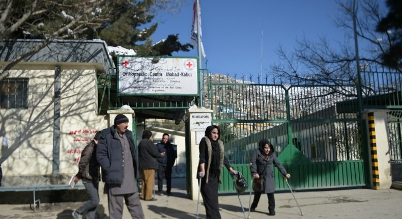 The flag of the International Committee of the Red Cross flies at half-mast at the entrance to the ICRC Orthopaedic Centre in Kabul on February 9, 2017