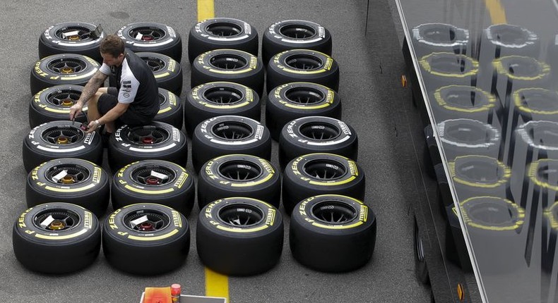 A Mercedes mechanic checks the pressure of Pirelli tyres ahead of the Italian F1 Grand Prix in Monza September 3, 2015. REUTERS/Max Rossi