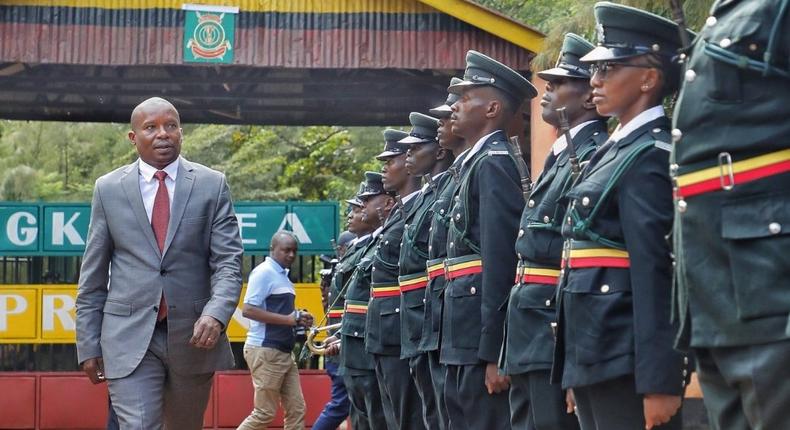 CS Kithure Kindiki inspects a guard of honour at Mwea Prison in Kirinyaga County on Monday, May 8, 2023.