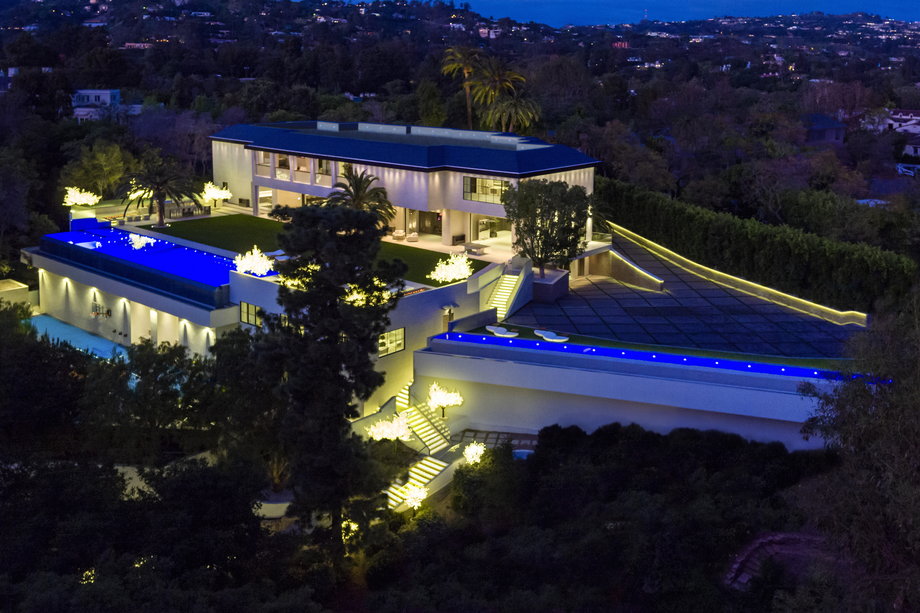 The massive home can be found on Carolwood Drive in Holmby Hills, one of Los Angeles' most exclusive neighborhoods. Walt Disney, Clark Gable, Gregory Peck, Frank Sinatra, Rod Stewart, and Elvis Presley all called Carolwood home at one point, according to a press release from listing agent Ginger Glass.