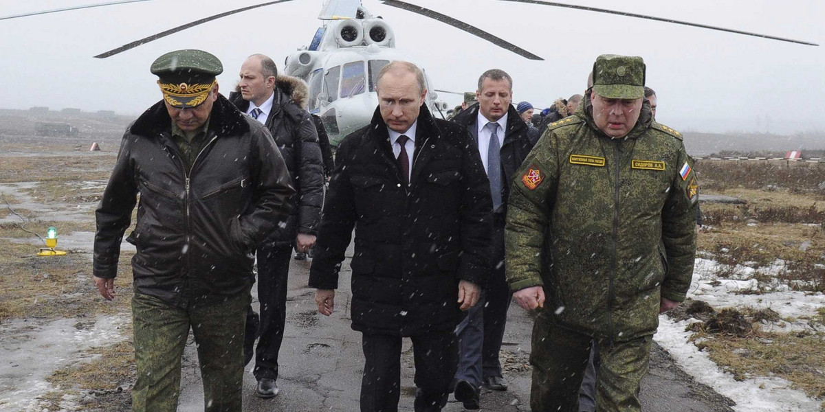 Putin walks to watch military exercises upon his arrival at the Kirillovsky firing ground.