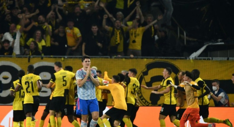 Harry Maguire walks away as Young Boys celebrate their last-gasp winner in Bern Creator: Fabrice COFFRINI