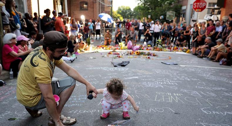 A vigil on Sunday at the spot where Heather Heyer, 32, was killed when a driver plowed into a crowd protesting against the Unite the Right rally in Charlottesville, Virginia.