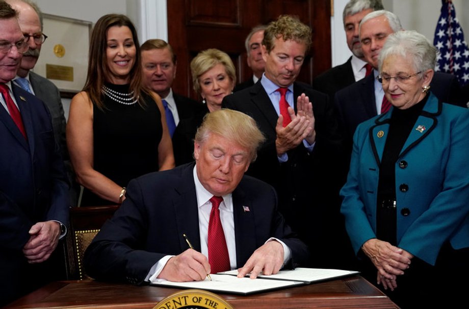 Trump signs an executive order on healthcare at the White House in Washington