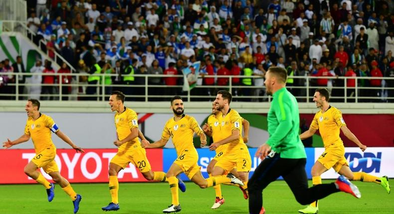 Australia's players celebrate their shoot out victory over Uzbekistan