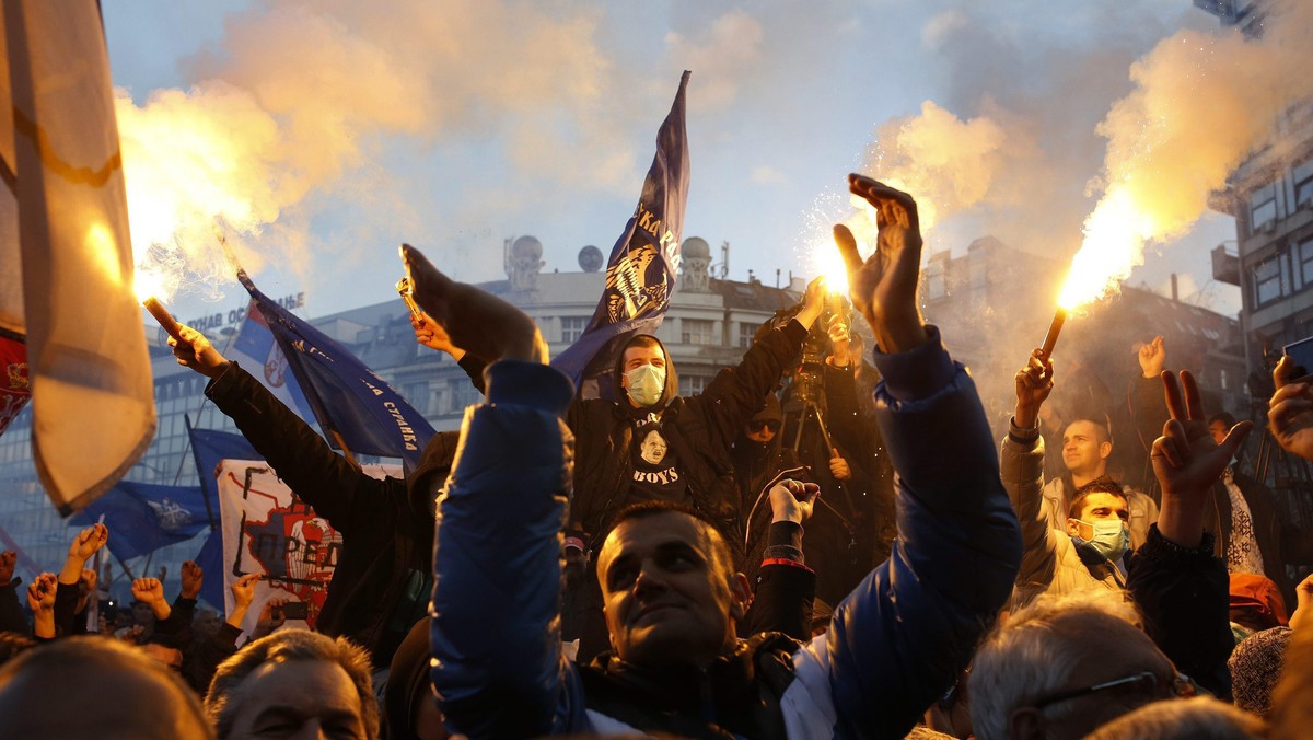 Supporters of Serbian ultra-nationalist leader Seselj light flares during an anti-government rally B