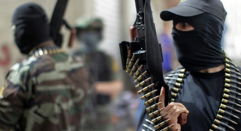 Islamic Jihad fighters chant anti-Israel slogans during a 2013 rally in the Gaza Strip refugee camp of Jabalia