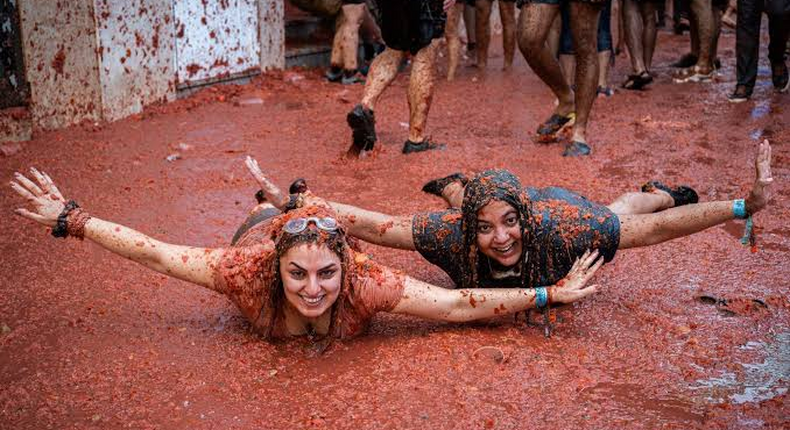 la Tomatina festival where they throw tomatoes at themselves as a form of entertainment
