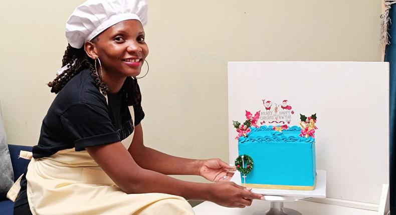Mary Nankinga Kawuki showing off a cake she made