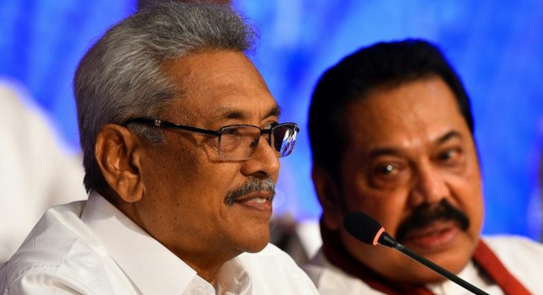 Sri Lankan presidential candidate Gotabhaya Rajapakse (left) with his brother, former president Mahinda Rajapakse during a press conference in Colombo