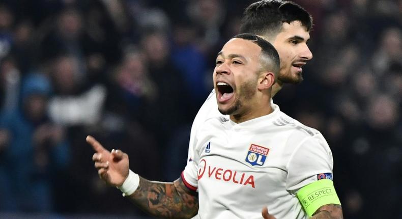 Memphis Depay's eighth goal of the season claimed a Champions League last 16 spot for Lyon