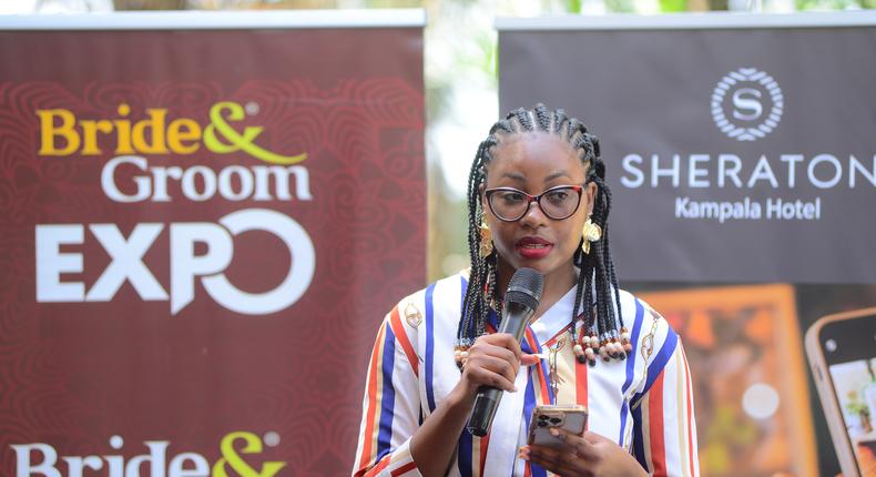 Evelyn Nansikombi the UBL Acting Brand Manger, Baileys gives a specch at the Bride and Groom Expo launch at Sherato Kampala Hotel
