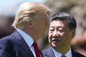 U.S. President Trump and China's President Xi walk together at the Mar-a-Lago estate after a bilater