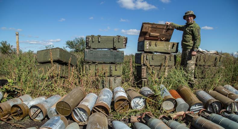 A Ukrainian soldier inspects ammunition left by the Russian troops in the recently retaken area close to Izium, Ukraine, Wednesday, Sept. 21, 2022.AP Photo/Oleksandr Ratushniak