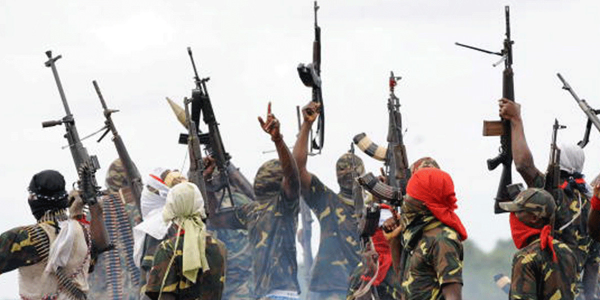 Fighters with the Movement for the Emancipation of the Niger Delta (MEND) raise their riffles to celebrate news of a successful operation by their colleagues against the Nigerian army in the Niger Delta, 2008. (Not the Niger Delta Avengers.)