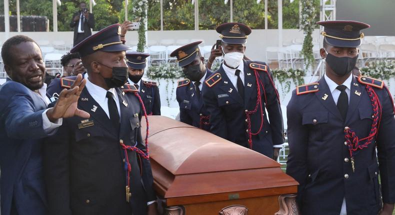 Soldiers of the Armed Forces of Haiti guard carry the casket of slain President Jovenel Mose before his funeral on July 23, 2021, in Cap-Haitien, Haiti.
