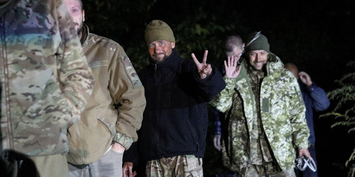 Ukrainian prisoners of war (POWs) walk after a swap at a location given as Chernihiv region