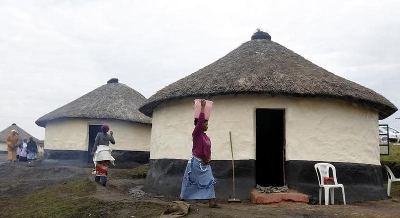 A woman carries a bucket of water outside Mthata, in South Africa's Eastern Cape province, September 8, 2012. REUTERS/Siphiwe Sibeko