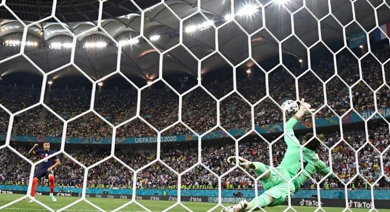 Switzerland goalkeeper Yann Sommer saves Kylian Mbappe's penalty in their last-16 shootout win over France Creator: FRANCK FIFE