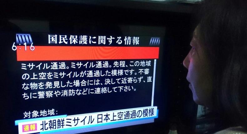 Japan's J-alert delivered ominous messages warning people to take cover after North Korea fired a missile over the north of the country