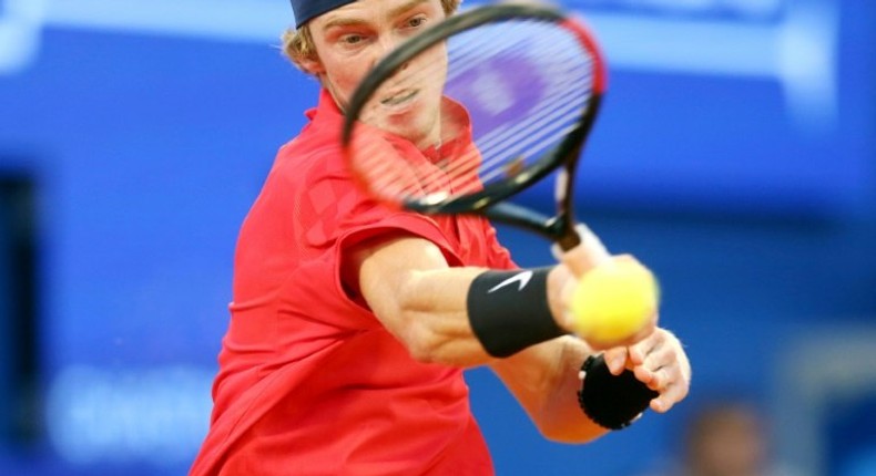 Russia's Andrey Rublev returns the ball on July 23, 2017