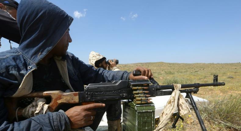 Fighters loyal to Libya's UN-backed unity government hold a position outside Tripoli as they fend off an offensive by strongman Khalifa Haftar