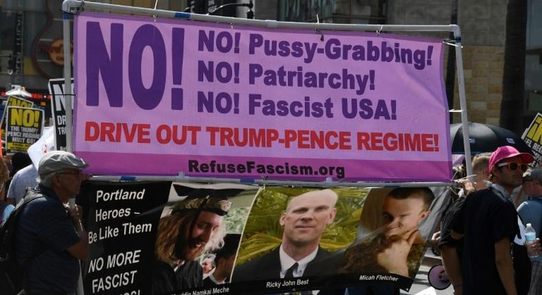 Demonstrators hold a banner at an anti-Trump protest in California, a state which has been at loggerheads with President Donald Trump's administration over various issues