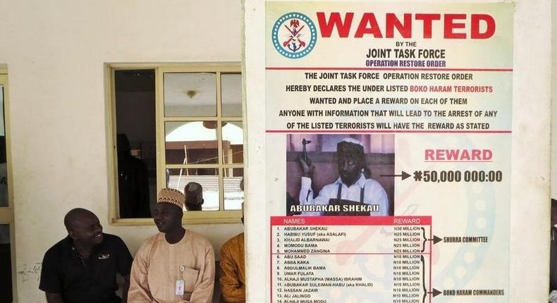 A poster advertising for the search of Boko Haram leader Abubakar Shekau is pasted on a wall in Baga village on the outskirts of Maiduguri, in the north-eastern state of Borno May 13, 2013. REUTERS/Tim Cocks