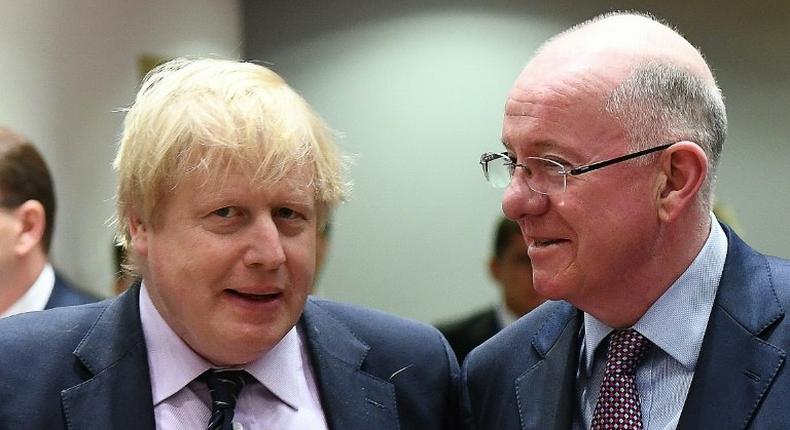 UK Foreign Secretary Boris Johnson (L) and Ireland's Foreign Minister Charlie Flanagan arrive to attend a foreign affair council at the European Council in Brussels, on March 6, 2017