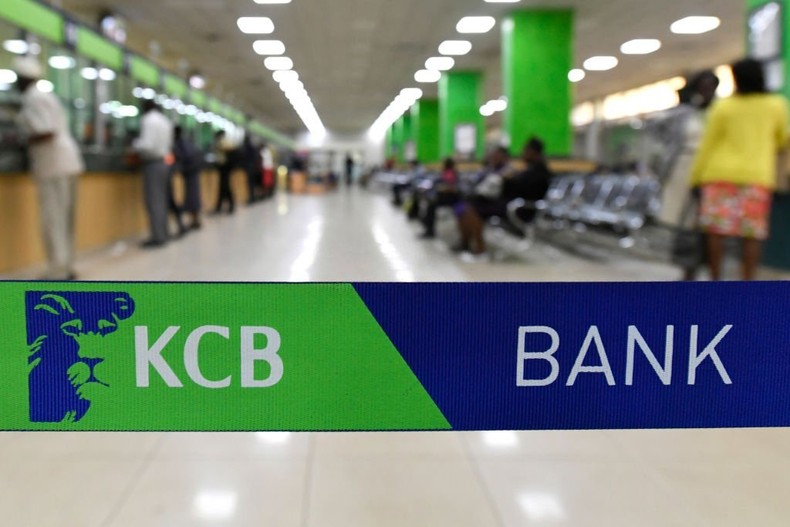 Customers are served at the Kenya Commercial Bank (KCB) in Nairobi on January 24, 2018. (Photo by SIMON MAINA/AFP via Getty Images)