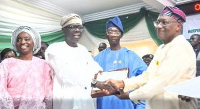 Gov. Babajide Sanwo-Olu (Second from Left) receiving Certificate of Return from INEC National Commissioner, Mr Sam Olumekun (Fourth from Left) on Thursday in Lagos.