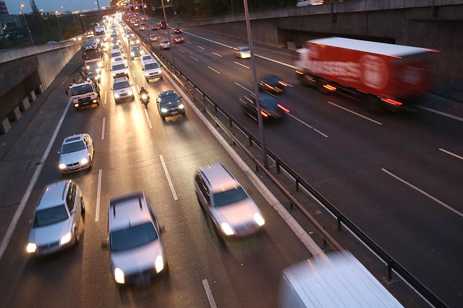 Cars and traffic fill the A100 ring highway in Berlin, Germany.