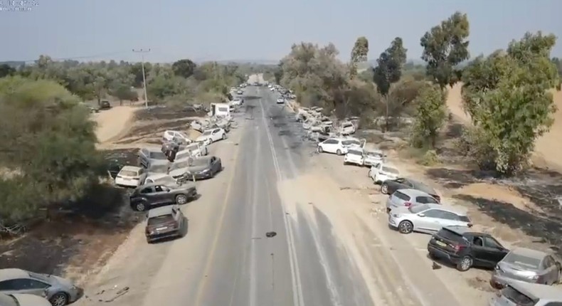 Dozens of scorched, burned cars and skid marks at the site of the Tribe of Nova trance music festival, near the Gaza Strip, Israel, on October 9, 2023.X/@samueloakford