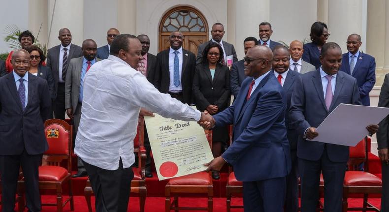 President Kenyatta hands over title deed to Kisii governor James Ongwae