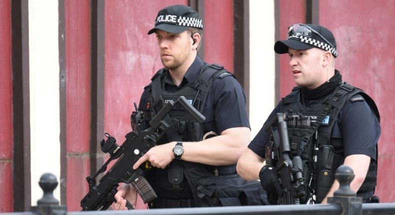 Armed police patrol near Manchester Arena on May 23, 2017 following a terror attack the previous evening