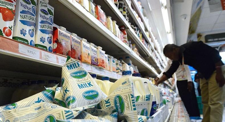 A consumer shops for Brookside dairy milk products in a supermarket in Kenya's capital Nairobi on July 28, 2014. Photo by SIMON MAINA/AFP via Getty Images