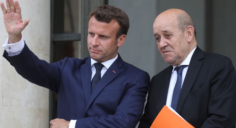 French President Emmanuel Macron and French Foreign Affairs Minister Jean-Yves Le Drian (right).
