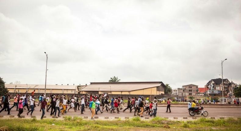 People take to the street during an opposition rally in Kinshasa, on September 19, 2016