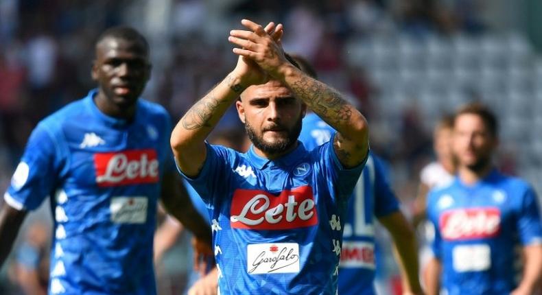 Lorenzo Insigne nets a brace as Napoli win 3-1 in Torino to join Juventus on top of Serie A.