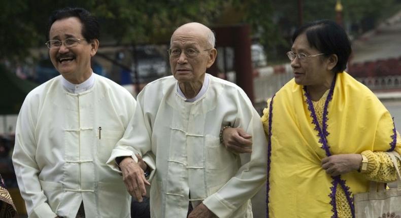 Soe Win (L) and Taw Phaya, the respective great grandson and grandson of King Thibaw, arrive to attend a ceremony at Mandalay's Golden Palace to mark the exile anniversary of their royal ancestor, in November 2016