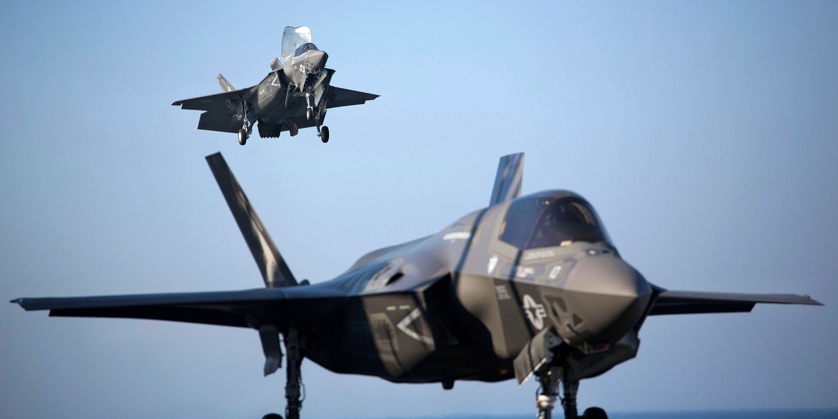 Two US Marine F-35B Lightning II Joint Strike Fighters complete vertical landings aboard the USS Wasp (LHD-1) during operational testing May 18, 2015.