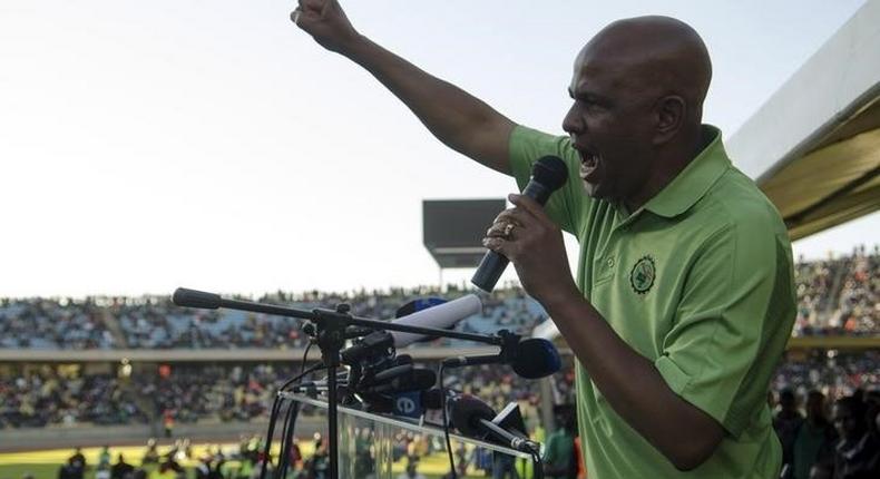 The Association of Mineworkers and Construction Union (AMCU) President Joseph Mathunjwa speaks to striking mine workers at the Royal Bafokeng Stadium in Rustenburg, June 23, 2014.   REUTERS/Skyler Reid