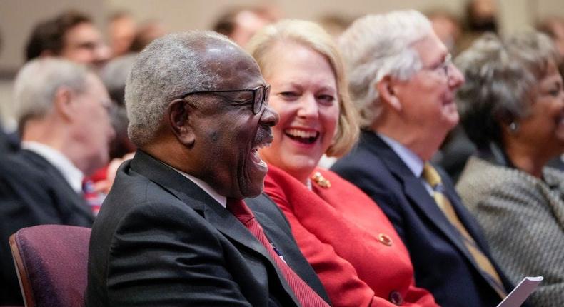 WASHINGTON, DC - OCTOBER 21: (L-R) Associate Supreme Court Justice Clarence Thomas sits with his wife and conservative activist Virginia Thomas while he waits to speak at the Heritage Foundation on October 21, 2021 in Washington, DC. Clarence Thomas has now served on the Supreme Court for 30 years. He was nominated by former President George H. W. Bush in 1991 and is the second African-American to serve on the high court, following Justice Thurgood Marshall.