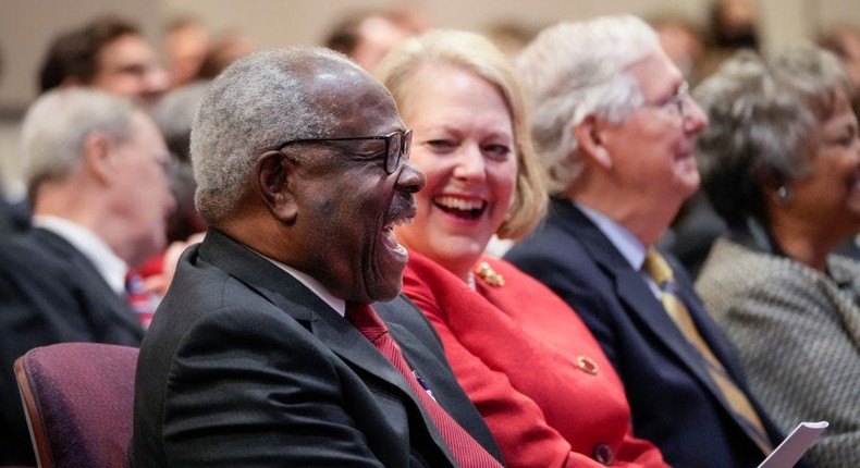 WASHINGTON, DC - OCTOBER 21: (L-R) Associate Supreme Court Justice Clarence Thomas sits with his wife and conservative activist Virginia Thomas while he waits to speak at the Heritage Foundation on October 21, 2021 in Washington, DC. Clarence Thomas has now served on the Supreme Court for 30 years. He was nominated by former President George H. W. Bush in 1991 and is the second African-American to serve on the high court, following Justice Thurgood Marshall.