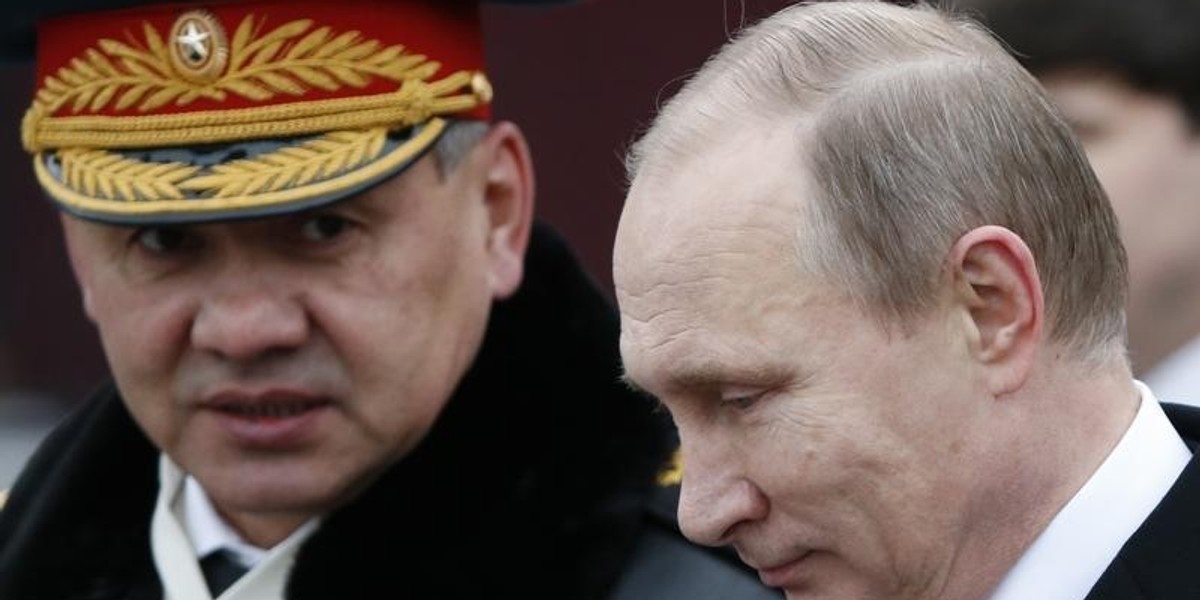 Russian President Putin and Defence Minister Shoigu attend a wreath laying ceremony to mark the Defender of the Fatherland Day at the Tomb of the Unknown Soldier by the Kremlin wall in central Moscow