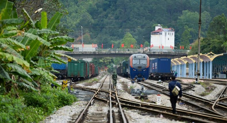 A Vietnamese soldier and railway worker inspect the track near the Dong Dang railway station, where North Korean leader Kim Jong Un is expected to arrive ahead of his summit with US President Donald Trump