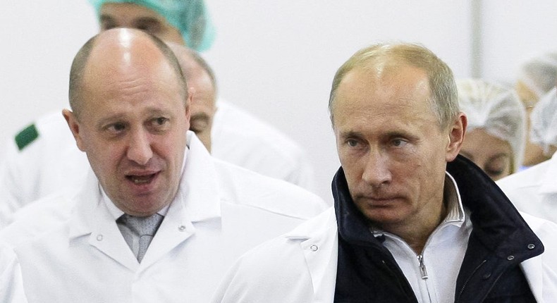 Yevgeny Prigozhin, who is accused of funding the Wagner Group, and Russian President Vladimir Putin.