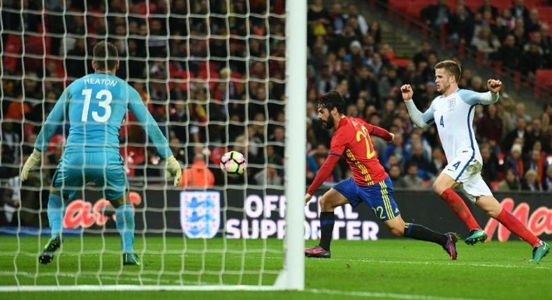 Spain's midfielder Isco (C) controls the ball to score his team's second goal during the friendly international football match between England and Spain at Wembley Stadium, north-west London, on November 15, 2016, which ended in a 2-2 draw